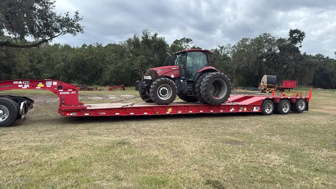 Tractor loaded on a transport trailer