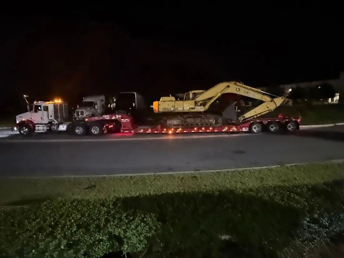 Caterpillar machine loaded on a lowboy in Polk County