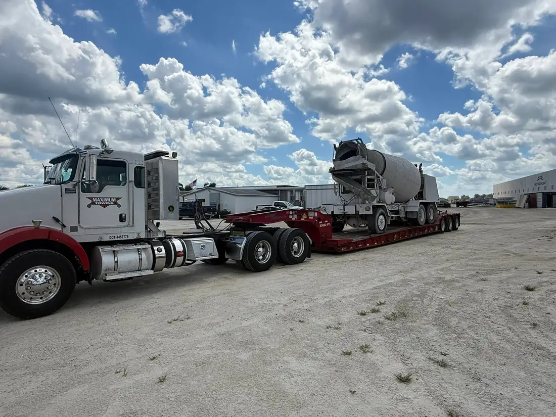 Concrete mixer on a heavy-haul lowboy trailer